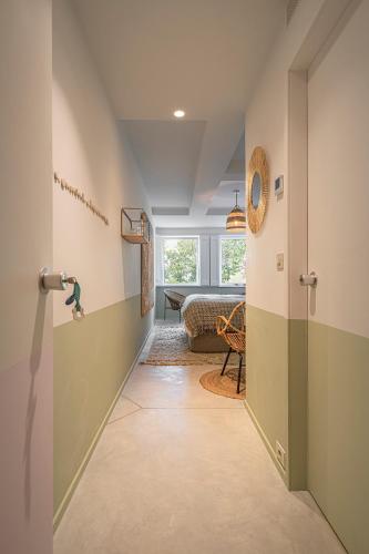 a hallway with a door leading to a bedroom at toctoctoc lisboa in Lisbon