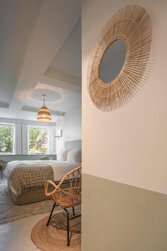 a bedroom with a bed and a mirror on the wall at toctoctoc lisboa in Lisbon