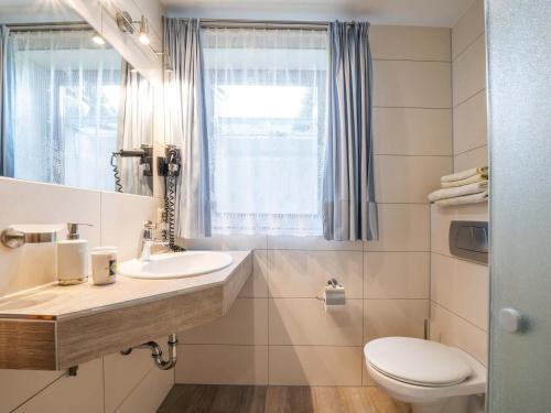 Koupelna v ubytování Hotel Seepark Appartements