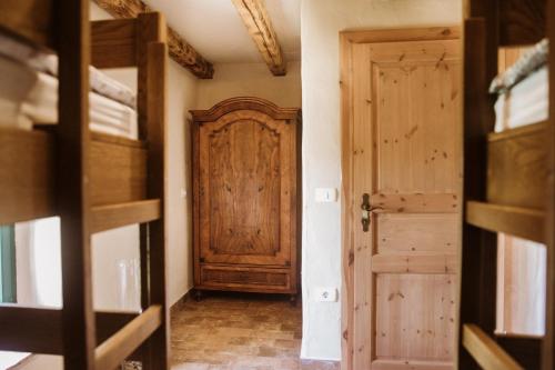 a hallway with a door and a room with bunk beds at Apartmaji Pajer in Koper