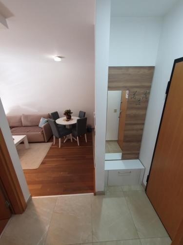 a living room with a couch and a table at Apartman Green Lux - Balkan Hil 1 in Zlatibor