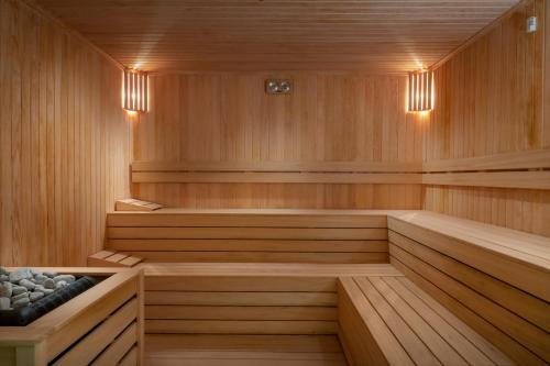 a sauna with wood paneling and lights in a room at Radisson Collection Hotel, Bodrum in Akyarlar