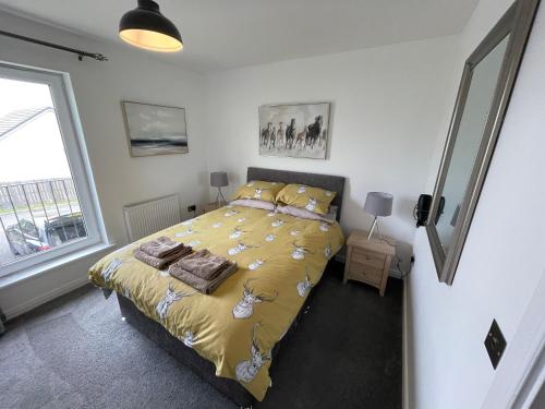 A bed or beds in a room at Gorsebank Mews