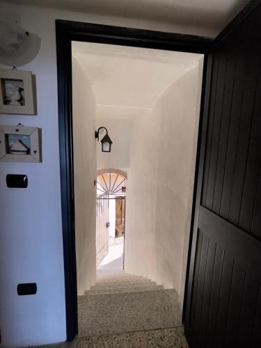 a door leading to a hallway with a hallway leading into a house at Casa del Borgo in Isca sullo Ionio