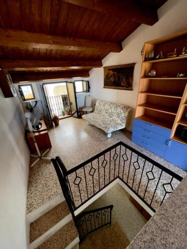 an overhead view of a living room with a couch and stairs at Casa del Borgo in Isca sullo Ionio