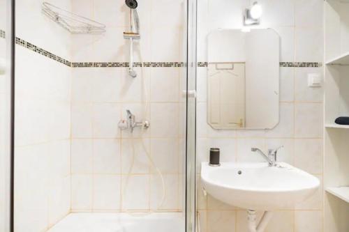 a bathroom with a shower and a sink at AZURE appartment in Keszthely