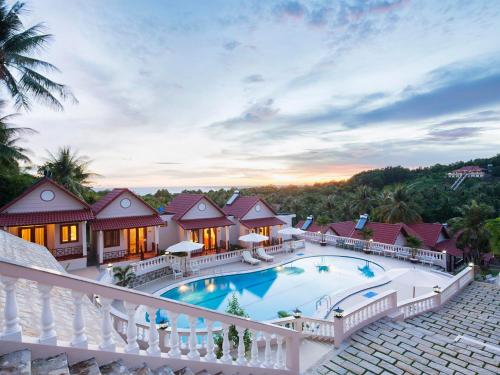 an aerial view of a house with a swimming pool at Hong Bin Bungalow in Phú Quốc