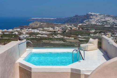 a pool on the side of a house with a view at Phaos 1870, A restored Winery in Pirgos
