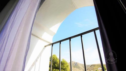 a window with a view of a mountain at Casona Granado in El Pilar y Provincias