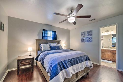 a bedroom with a bed and a ceiling fan at Lakefront Home Less Than 3 Miles to Historic Granbury! in Granbury