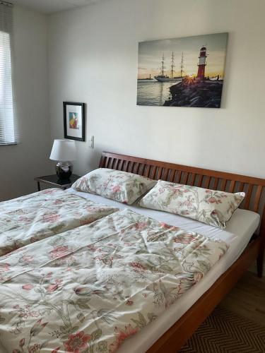 a bedroom with a large bed with a lighthouse at Alte Gießerei in Ziesendorf