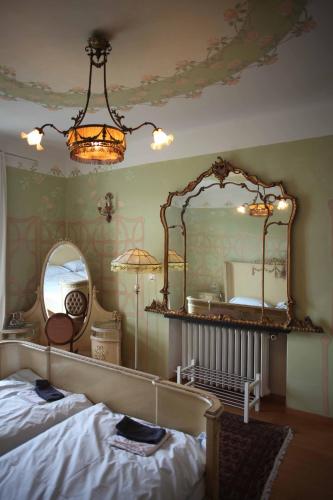 a bedroom with a bed and a large mirror at Bed and Breakfast Casa Locarno in Locarno