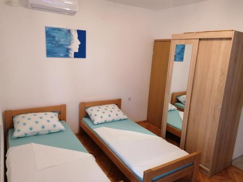 Posteľ alebo postele v izbe v ubytovaní Studio apartman Promona