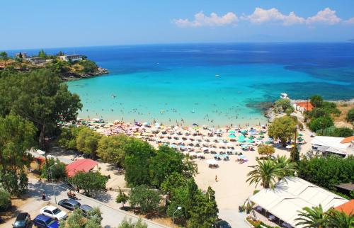 an aerial view of a beach with people in the water at Katafigio Village in Kotrónion