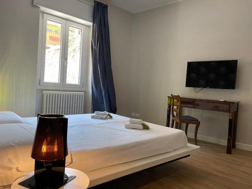 Ένα ή περισσότερα κρεβάτια σε δωμάτιο στο Ramiè Verona Centro Ponte Pietra
