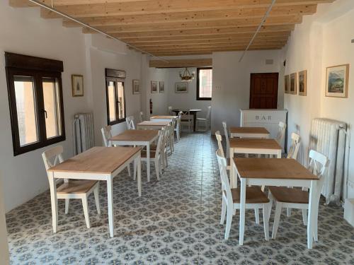 a restaurant with tables and chairs in a room at Castillo de Bulbuente de Luis Zueco in Bulbuente