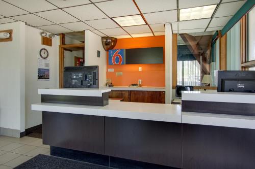 an office lobby with a reception desk and a waiting room at Wingate by Wyndham Geneva at SPIRE Academy in Geneva