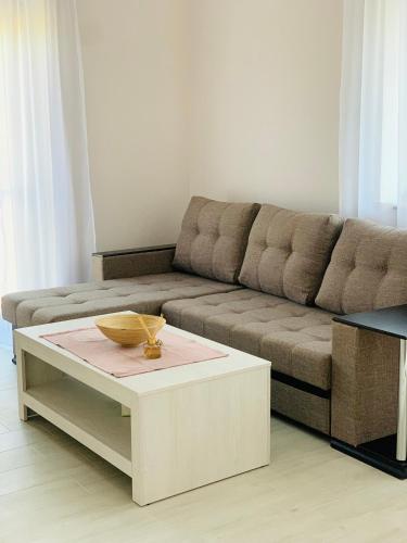 a living room with a couch and a coffee table at Harmony Resort in Tsaghkadzor