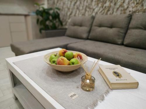 a bowl of fruit on a table in a living room at Harmony Resort in Tsaghkadzor