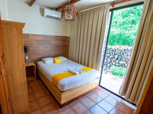 Postel nebo postele na pokoji v ubytování Hotel Bahia del Sol