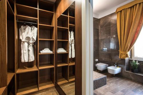 a bathroom with a toilet and a sink at Oca Apartment - Alta Luxury Apartments in Rome