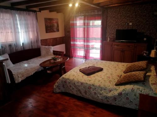 Posteľ alebo postele v izbe v ubytovaní Ranch pod lesom Slovensky Raj