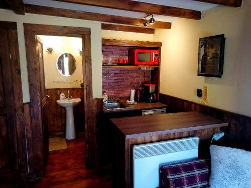 a small bathroom with a sink and a sink at Ranch pod lesom Slovensky Raj in Spišský Štiavnik