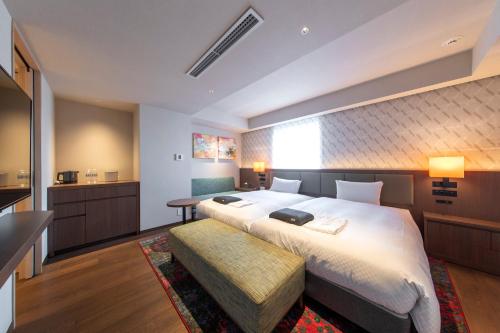 Postel nebo postele na pokoji v ubytování Hotel Forza Nagoya Sakae