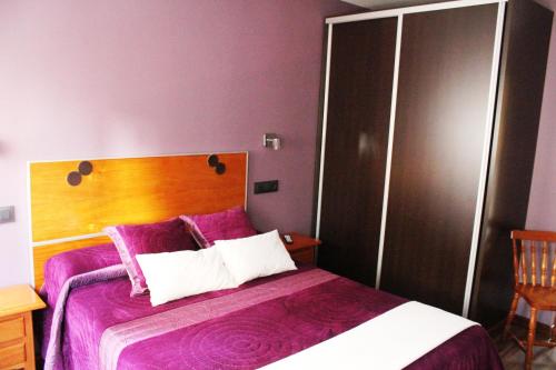 Postel nebo postele na pokoji v ubytování Hostal Extremeño