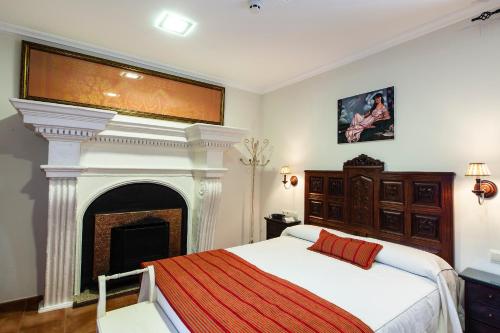 Posteľ alebo postele v izbe v ubytovaní Hotel Palacio del Intendente