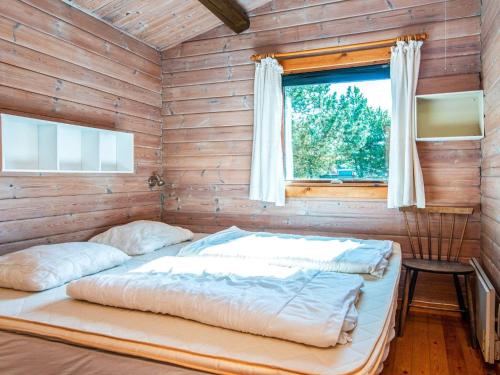 En eller flere senge i et værelse på 6 person holiday home in Rømø-By Traum