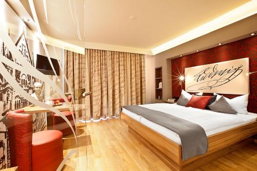 a bedroom with a large bed in a room at Hotel Weinbauer in Schwangau