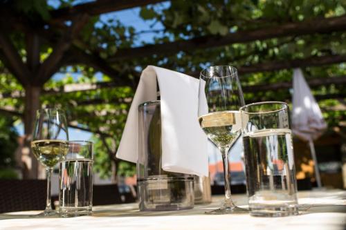 four glasses of wine sitting on a table at Feldkirchnerhof in Feldkirchen bei Graz