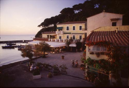 an aerial view of a building next to the water at Hotel Mare in Portoferraio