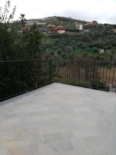 a balcony with a view of a city at La Torretta di Piero con terrazzi e parcheggio privato Citra zero zero ottanta 31LST0282 in Imperia