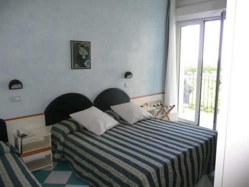 Postel nebo postele na pokoji v ubytování Hotel Poker