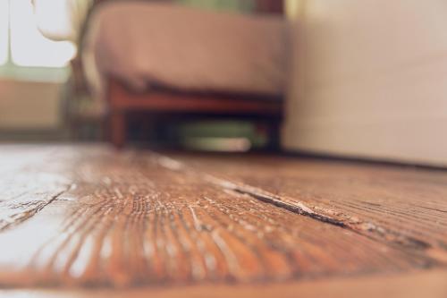 a close up of a wooden floor in a room at Chateau De Grosfy in Hugleville-en-Caux