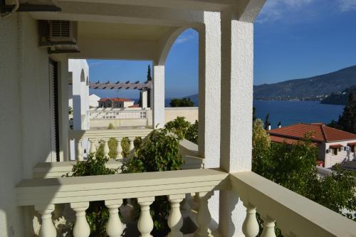 a balcony with a view of the water at To Spiti Tis Eirinis in Poros