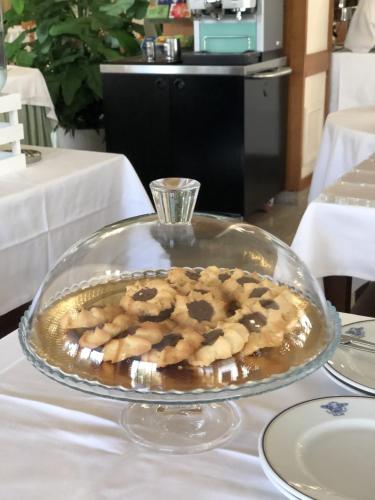 a plate of cookies on top of a table at Grand Hotel Cesare Augusto in Sorrento