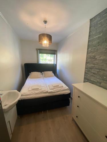 Ένα ή περισσότερα κρεβάτια σε δωμάτιο στο Kvamseter Lodge private family apartment