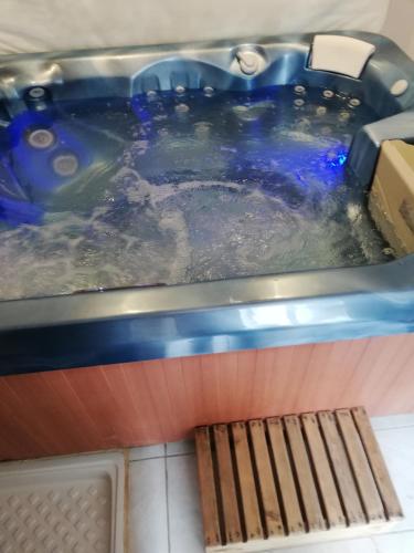 a jacuzzi tub in a kitchen with a sidx at appartement saisonnier in Sorède