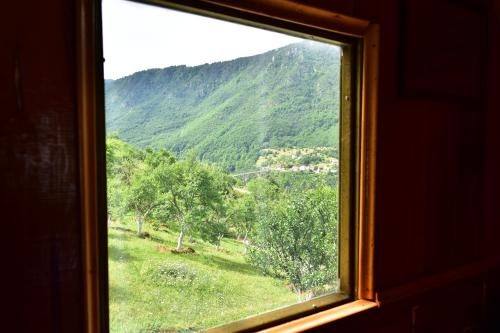 a view of a mountain from a window at Kljajevica Orchard in Pljevlja