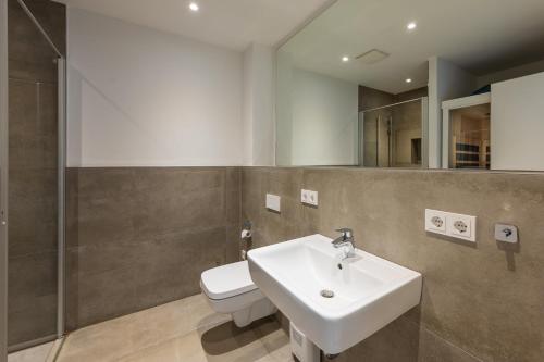 a bathroom with a sink and a toilet at Marina Martinshafen in Sassnitz