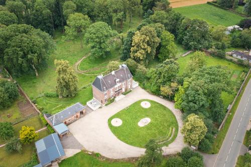 an aerial view of a house with a golf course at Bed & Breakfast au Château de Martinsart in Mesnil-Martinsart
