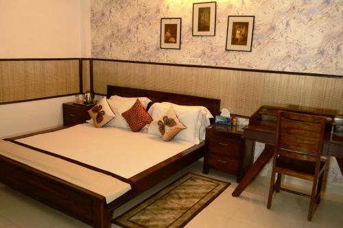 
A bed or beds in a room at House of Comfort Noida

