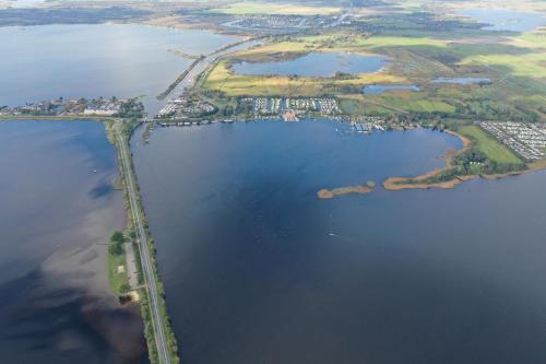 an aerial view of a large body of water at BenB Weerribben Wieden in Wanneperveen