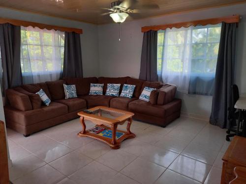 a living room with a couch and a coffee table at Urania House in Bocas del Toro