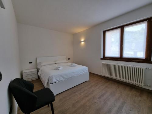 Postel nebo postele na pokoji v ubytování Tenno Appartamenti Garda Lake
