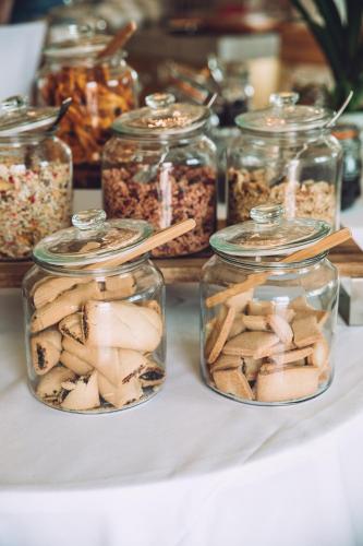 a group of jars filled with food on a table at Mas des Herbes Blanches Hôtel & Spa – Relais & Châteaux in Joucas