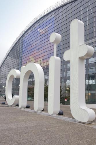 a large sign in front of a building at Aparthotel Adagio Access La Défense - Léonard De Vinci in Courbevoie